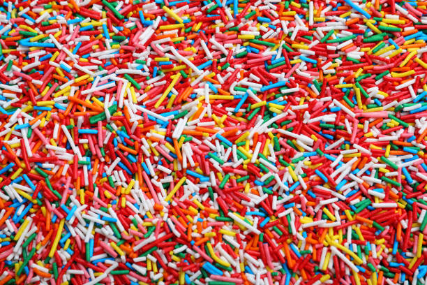 istock Bright colorful sprinkles as background, top view. Confectionery decor 1309213176