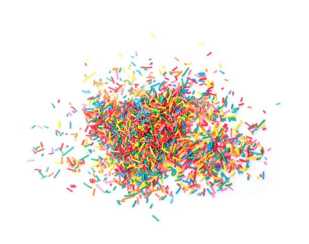 Colorful sprinkles on white background, top view. Confectionery decor Colorful sprinkles on white background, top view. Confectionery decor sprinkling stock pictures, royalty-free photos & images