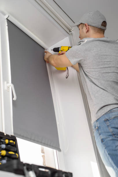 istock Male hands fixing the handle of a plastic window using a screwdriver 1309215425
