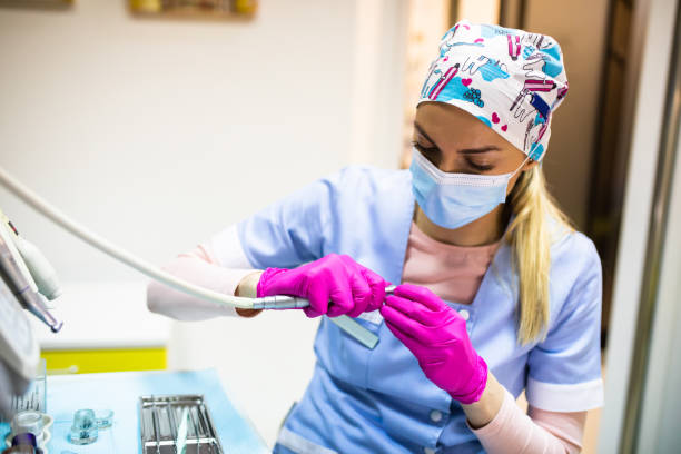 istock A female pediatric dentist attaching a drill bit 1309216004