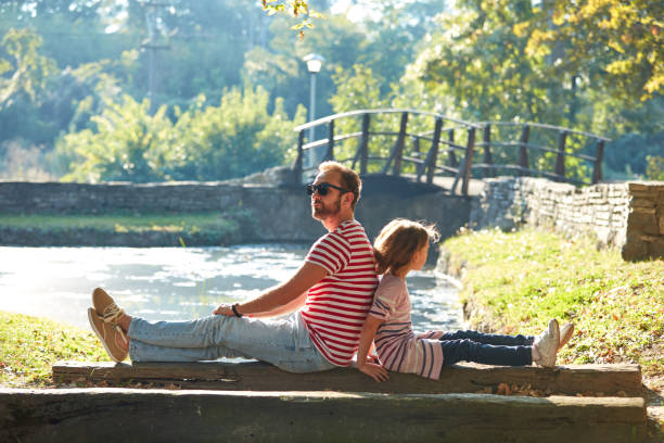 istock Daughter and father enjoying outdoors nature. 1309217279