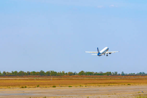 istock Passenger plane takes off from runway in airport 1309217422