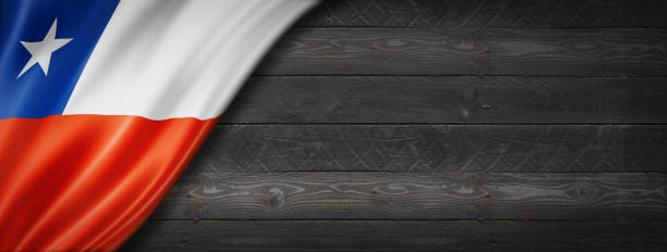 istock Chilean flag on black wood wall banner 1309219055