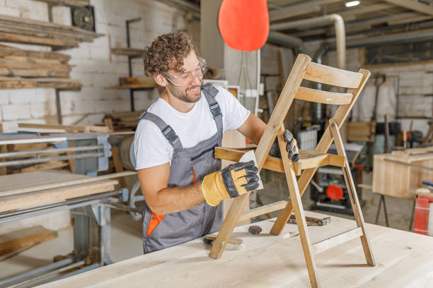 istock A Carpenter is Sanding and Preparing an Old and Rustic Chair. 1309220941