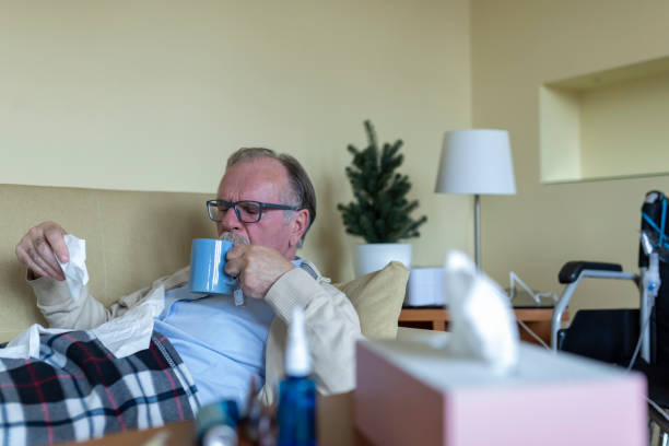 istock Sick Senior Man is Lying in the Bed Due to High Temperature. 1309223789