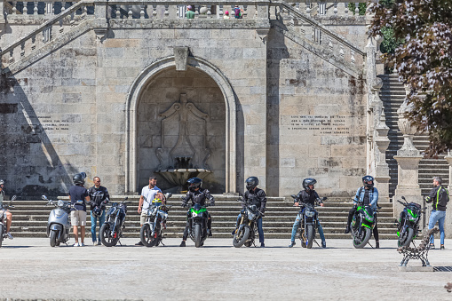 Lamego / Portugal - 07 25 2019 : View at the staircase entrance with a group of bikers and motorcycles, Lamego Cathedral with a huge stairway