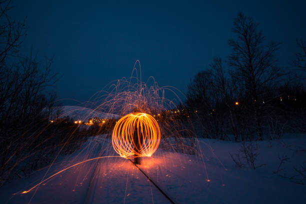 istock Fire painting at cold winter at night 1309224866