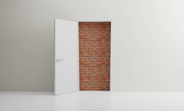 istock Door open to reveal red brick wall blocking the way in a modern room 1309227454