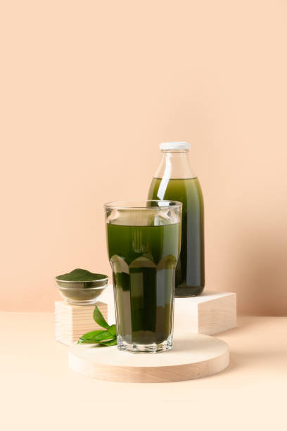 istock Chlorella Detox drink in glass on beige background. Vertical. 1309228769