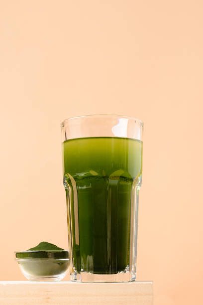 istock Chlorella Detox drink in glass on beige background. Vertical. 1309228770