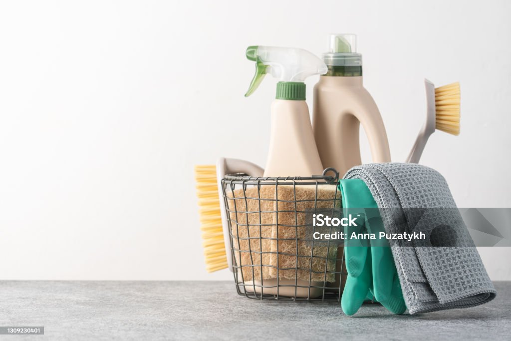 Brushes, sponges, rubber gloves and natural cleaning products in the basket Eco-friendly cleaning products Cleaning Product Stock Photo