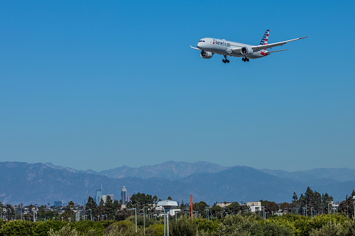 Los Angeles, California, USA - October 19, 2018: Boeing 787 Dreamliner American Airlines (AA) landing at LAX (Tom Bradley International Airport) in Los Angeles at mid day over traffic city streets.