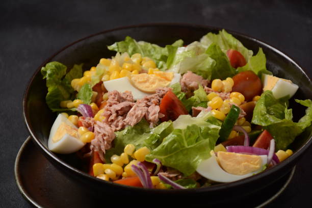 istock Tuna Fish Salad with Lettuce, Cherry Tomatoes, Cucumber, boiled eggs, onions and Corn 1309230709