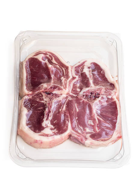 istock Raw lamb chops in vacuum package isolated on white 1309234778