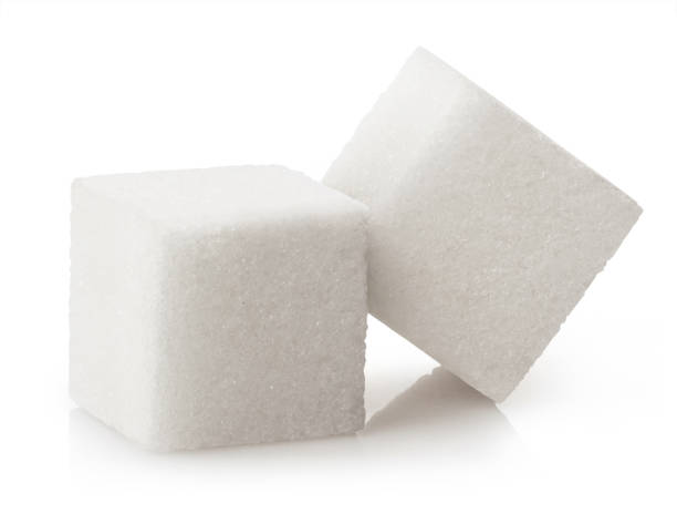 istock Close-up of two white sugar cubes on white 1309235536