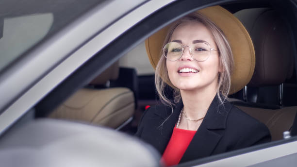 istock Female driver enjoying new car 1309237436