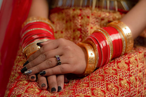 istock Bride with Red Bangle and Black Nail Paint Combination 1309237453