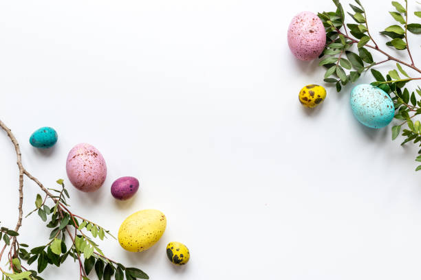 istock Frame of Easter eggs with spring branches and green leaves. Veiw from above 1309238270
