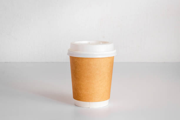 istock Take out coffee paper cup on the table. Close up 1309238328