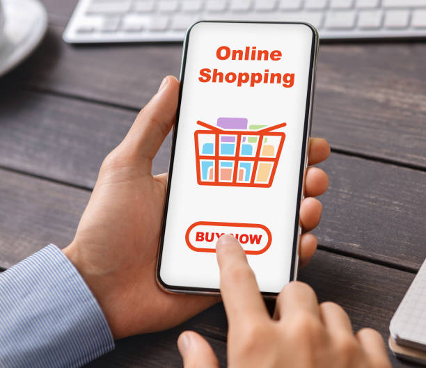istock Male hands holding mobile phone with online shopping application 1309238605