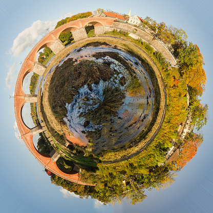 Beautiful little planet with red brick bridge.