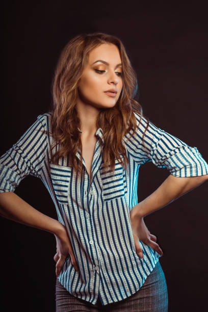 istock Attractive young model posing in striped shirt at studio 1309239506