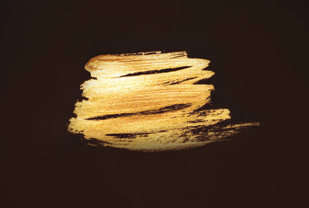 istock Abstract golden watercolor stain on black background 1309239801