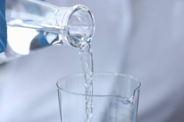 istock Pure water is poured from a bottle into transparent glass 1309240704