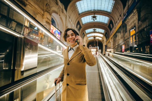 istock Smiling handsome businessman using smart phone 1309240826