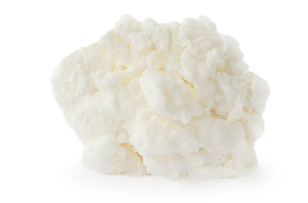 istock Cottage cheese isolated on white background closeup. Diary Products with high protein 1309241057