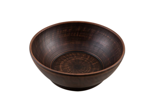 ancient ceramic brown clay plate isolated on white ancient ceramic brown clay plate isolated on white. handmade antique fruit bowl stock pictures, royalty-free photos & images
