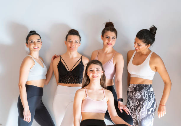 istock Medium group of yoga students chatting and laughing together in the yoga class 1309242514