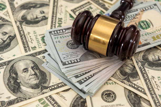 istock dollar money and judges gavel on table 1309242679