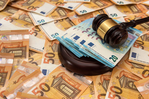 istock Judge hammer on 50 Euro banknotes background 1309243863