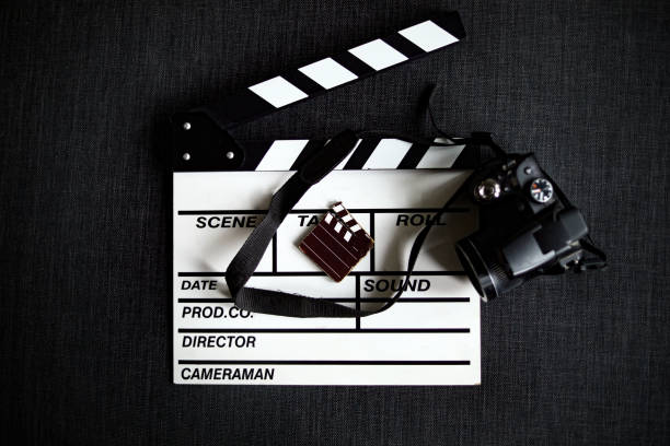 istock film Scatter And Camera On a Gray Background 1309244110