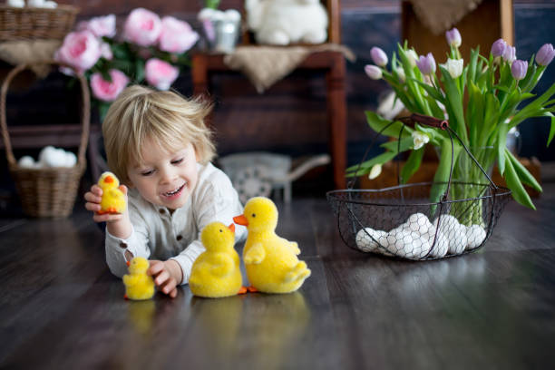 istock Cute toddler blond child, boy with easter decoration 1309244152