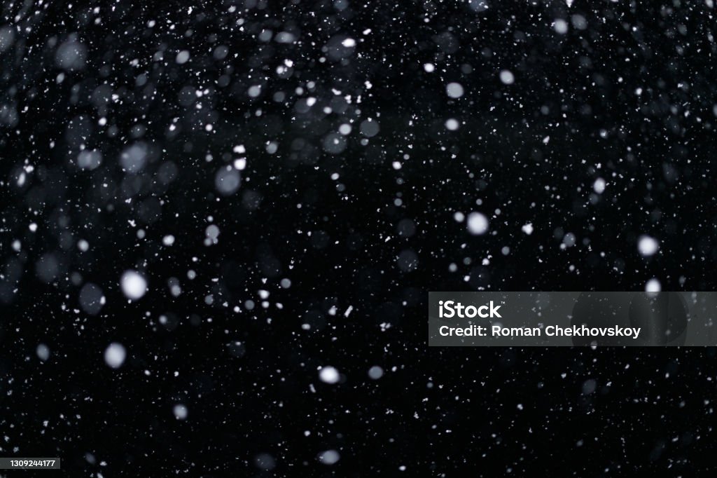 Real falling snow on black background for blending modes in ps. Ver 01 - many snowflakes in blur Real falling snow on black background for blending modes in ps. Ver 01 - many snowflakes in blur. Snow Stock Photo