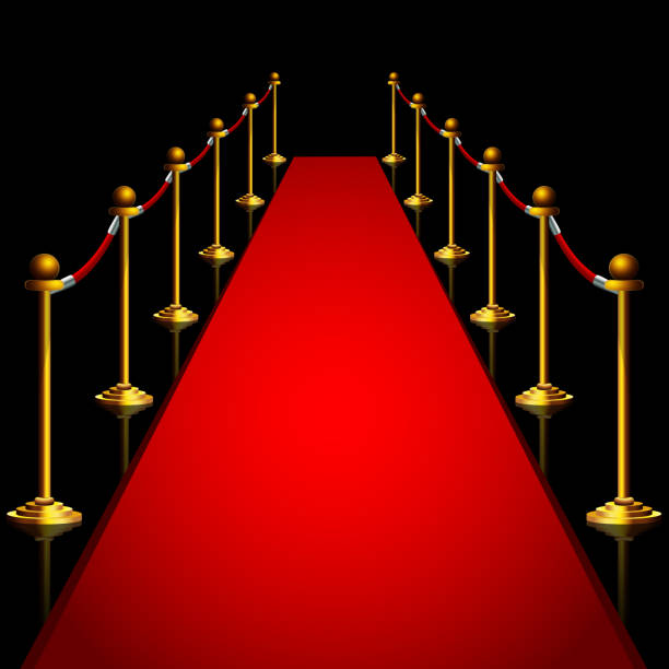 istock Red carpet and gold stanchoins at night 1309245685