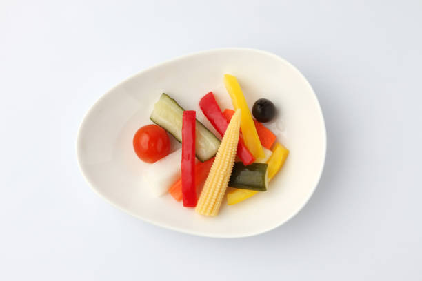 pickles pickled vegetables salad on plate isolated on white background