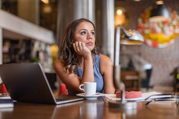 istock Young business woman thinking about something 1309251103