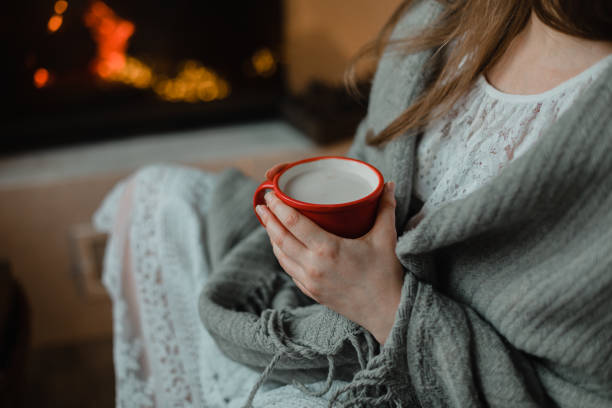 istock Midsection Of Woman Holding Coffee Cup 1309251947