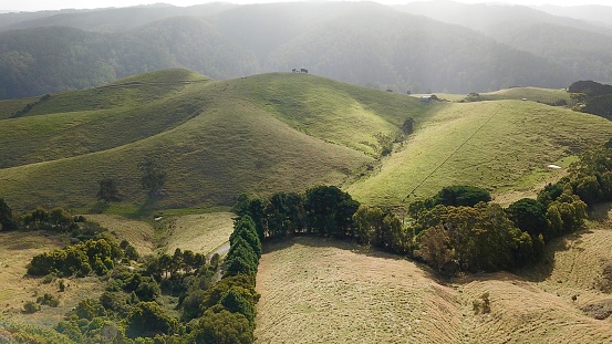 Aerial photography of green meadows and hills in the country