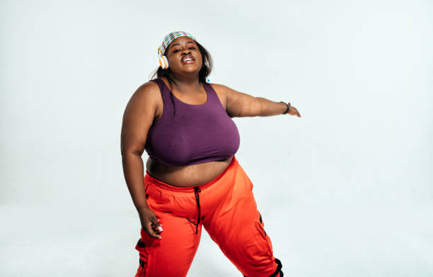 istock Young woman dancing and making functional training at the gym 1309255486
