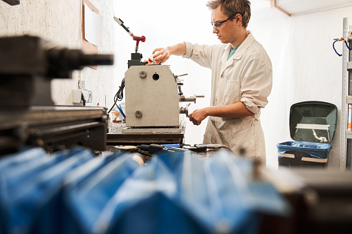 Engineer Robe Man Engineer Wearing White Robe Working At The Special Machine While ...