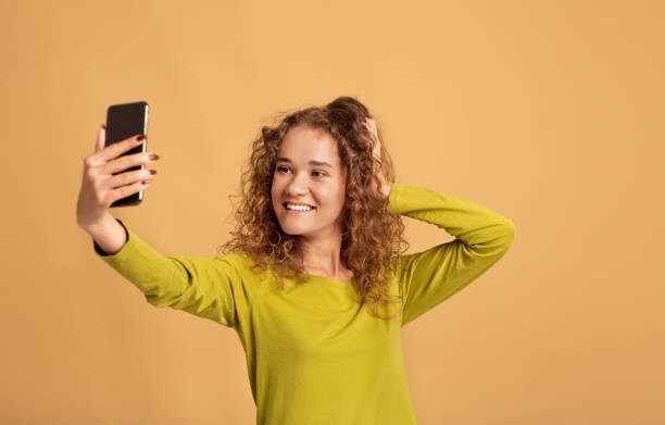 istock Modern student, blogger, selfie, app, device and beauty for social networks 1309255595
