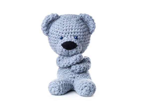 istock Bear handmade toy isolated on white background. Crochet blue bear 1309256339