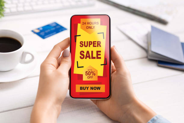 istock Unrecognizable woman shopping online while working in office 1309256542