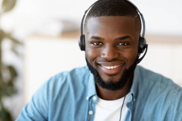 istock Hotline Support Service. Portrait Of Smiling African Customer Service Operator In Headset 1309256755