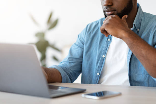 istock Busy Black Entrepreneur Working With Laptop At Office, Focused On Screen 1309256927
