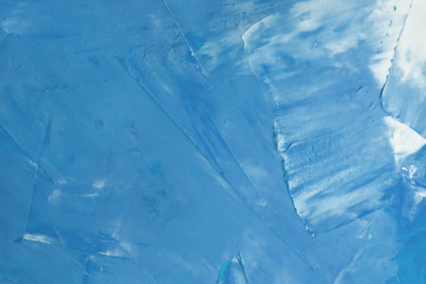 istock The surface is covered with blue paint with white streaks background. 1309259839